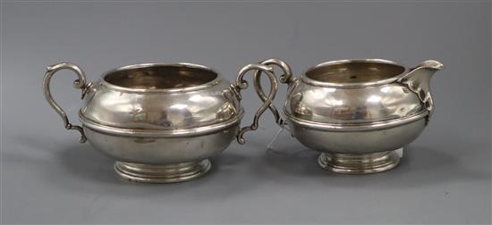 A George V silver cream jug and matching sugar bowl, 13 oz.